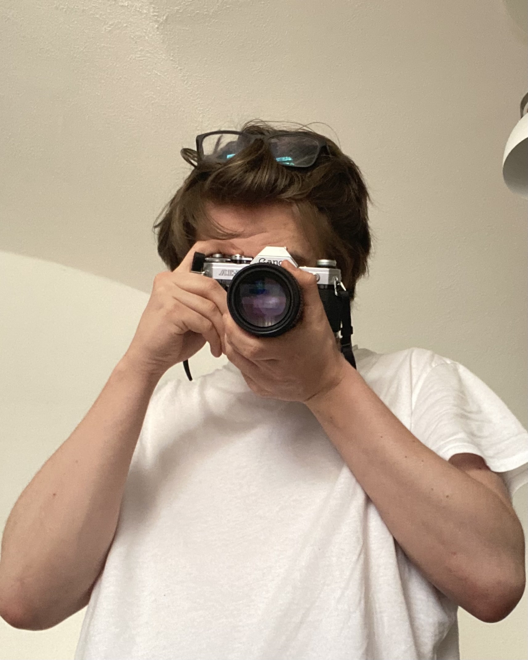 Me with my old Canon AE-1 camera pretending to take a photo.